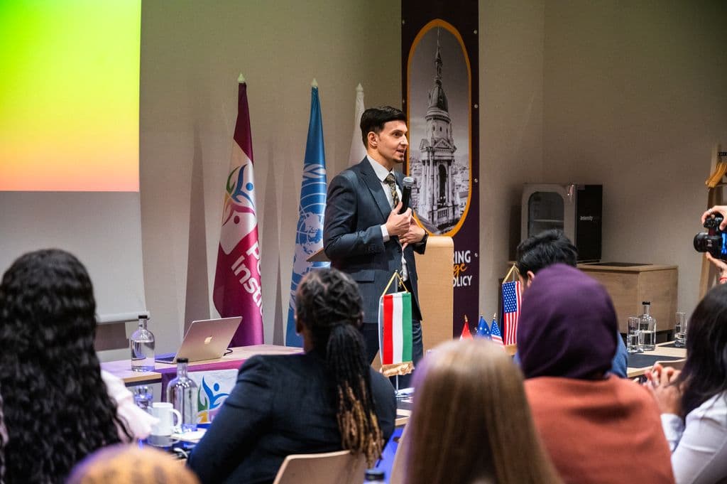 Speaker addressing the international forum audience